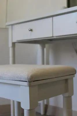 a white desk with a drawer and a stool at 3-Story Gaudi Building with Montserrat Stone in Monistrol