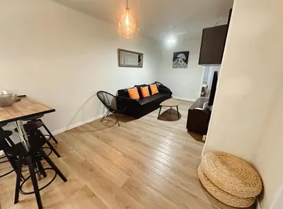 a living room with a couch and a table at 2 bedrooms apartment in Barcelona F1 in Hospitalet de Llobregat
