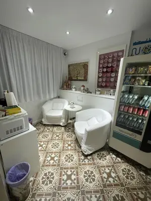 a kitchen with a refrigerator and a floor at Hostal Nova Barcelona in Barcelona