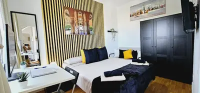 a small bedroom with a bed and a desk at Premium refurbished apartment in Barcelona city center in Barcelona