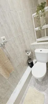 a bathroom with a white toilet and a shower at Premium refurbished apartment in Barcelona city center in Barcelona