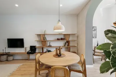 a bedroom with a bed with a book on it at Faro - 2 bedroom in Eixample Esquerra in Barcelona