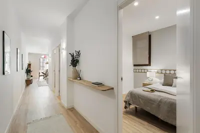 a living room with a couch and a table at Faro - 2 bedroom in Eixample Esquerra in Barcelona