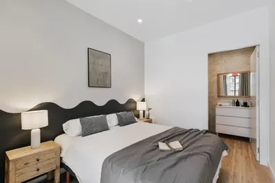 a living room with a couch and a table at Faro - 2 bedroom in Eixample Esquerra in Barcelona