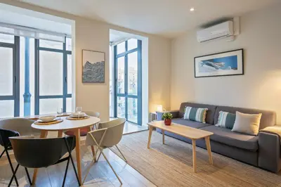 a living room with a couch and a table at Click&Flat Gran Via Barcelona in Barcelona