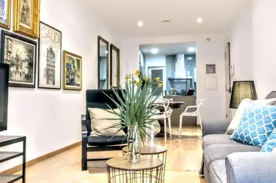 a living room with a couch and a table at La Rambla spacious 3BR monthly rental - Parsifal in Barcelona