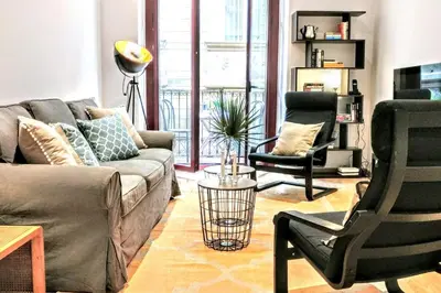 a living room with a couch and two chairs at La Rambla spacious 3BR monthly rental - Parsifal in Barcelona