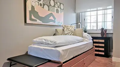 a bedroom with a bed with a dresser and a picture at Gatsby - 3BR Luxury high floor Terrace by Lilla in Barcelona