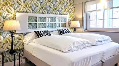 a bedroom with two beds with white pillows at Gatsby - 3BR Luxury high floor Terrace by Lilla in Barcelona