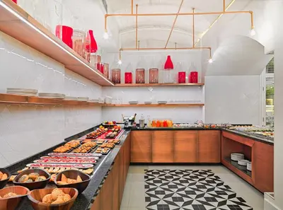 a buffet line with many different types of food at H10 Cubik 4* Sup in Barcelona