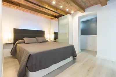 a bedroom with a large bed in a room at Apartamento Barcelona playa in Barcelona