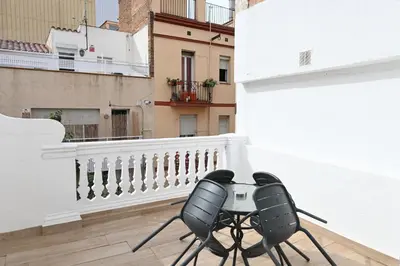 a pair of chairs sitting on a balcony at Homenfun Barcelona Camp Nou in Hospitalet de Llobregat
