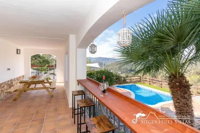 a bathroom with a mirror and a sink at Sunny Villa Moments near Sitges in Olivella