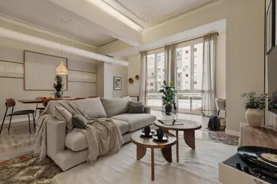 a living room with a couch and a table at Savegre - 3 bedrooms in Eixample Esquerra in Barcelona