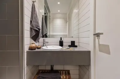 a white bathroom with a sink and a shower at Savegre - 3 bedrooms in Eixample Esquerra in Barcelona