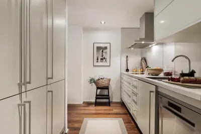 a dining room with a table and chairs at Cabuy - 1 bedroom in La Dreta de l'Eixample in Barcelona