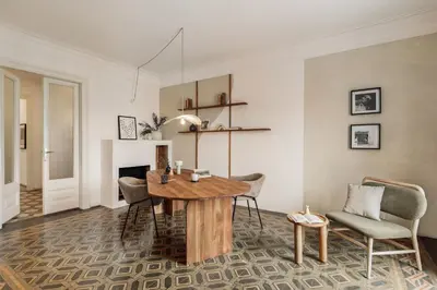 a living room with a couch and a table at Mirra - 5 bedrooms and terrace in Eixample Dreta in Barcelona