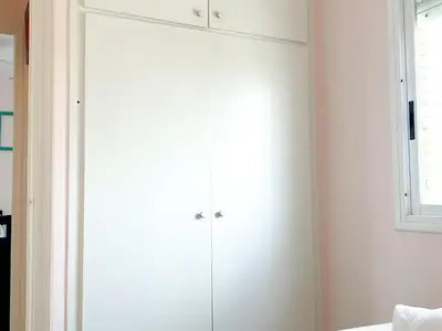 a white cabinet in a room with a window at Apartment Sunset in Cunit