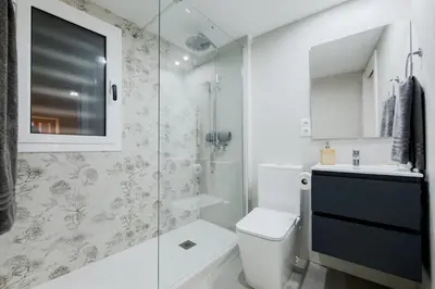 a bathroom with a toilet and a glass shower at Acogedor y céntrico Estudio 2 in Barcelona