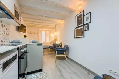 a kitchen and living room in a apartment at Acogedor y céntrico Estudio 2 in Barcelona