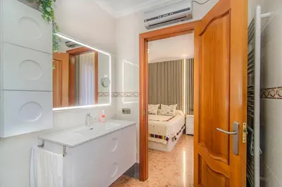 a bathroom with a sink and a mirror at Casa con piscina salina a 5 minutos de Sitges in Canyelles