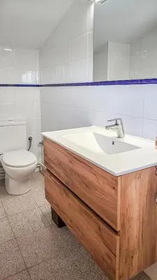 a bathroom with a sink and a toilet at Casa con piscina salina a 5 minutos de Sitges in Canyelles