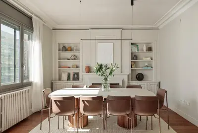 a white dining room with a table and chairs at Enjoy Apartments Augustina's Grand Family Suite in Barcelona