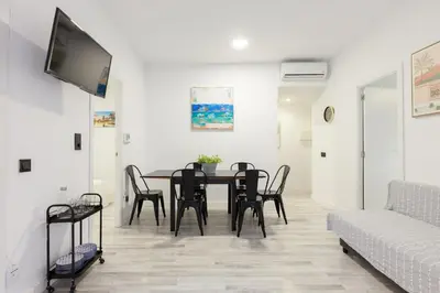 a dining room with a table and chairs at matarolux21 in Mataró