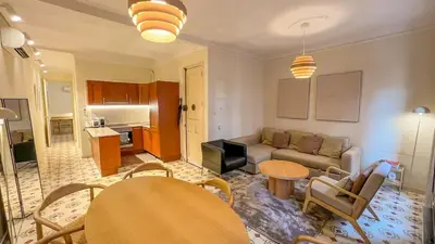 a living room with a couch and a table at 