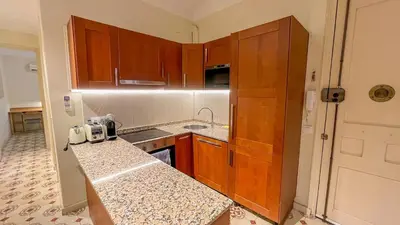 a kitchen with wooden cabinets and a counter top at 