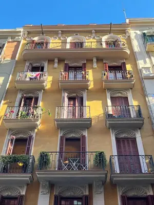 a tall building with balconies on the side of it at 