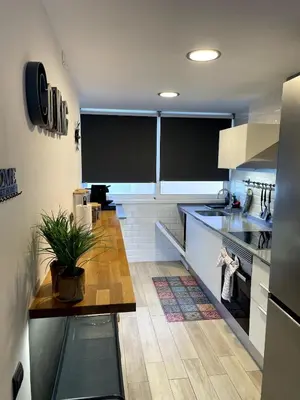 a kitchen with blackboards on the walls of a kitchen at Ocean View Sunny Beach Apartment Castelldefels in Castelldefels