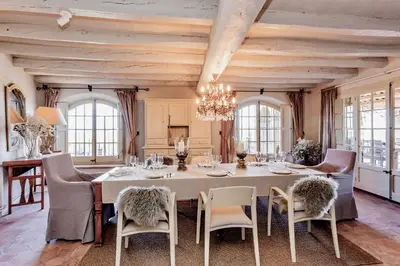 a dining room with a large white table and chairs at Montrural in Castellví de la Marca