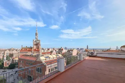 a view of a city from the roof of a building at ApartEasy - Lovely Atic in Barcelona in Barcelona
