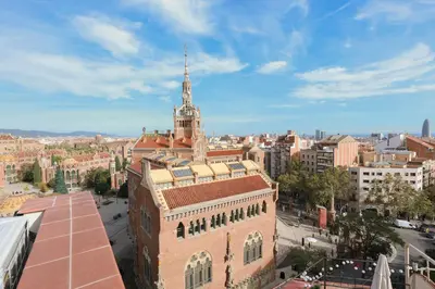 an aerial view of a city with a tall building at ApartEasy - Lovely Atic in Barcelona in Barcelona