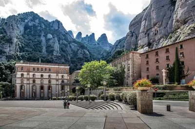 a group of buildings in front of a mountain at Cal Sopas in Collbató