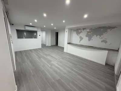 an empty room with a world map on the wall at Hostel Hock Residences in Hospitalet de Llobregat