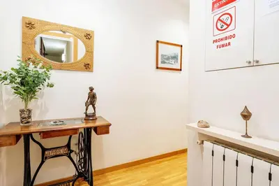 a room with a table and a mirror on the wall at Magnífico apartamento en el centro in Barcelona