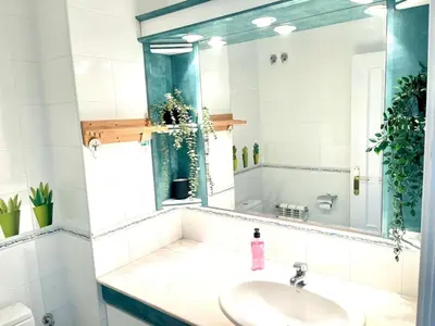 a bathroom with a sink and a mirror at Camins de Montserrat in El Bruc