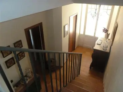 a staircase in a house with a stair case at Casa de pueblo con jardín in Premiá de Mar