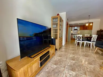a living room with a large flat screen tv at Amazing apartment close to the beach Eli by Hl in Vilanova i la Geltrú