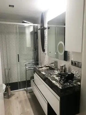 a bathroom with a sink and a shower at Sitges Oasis in Sitges