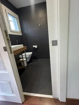 a bathroom with a toilet and a sink at Mery Castelldefels Beach in Castelldefels