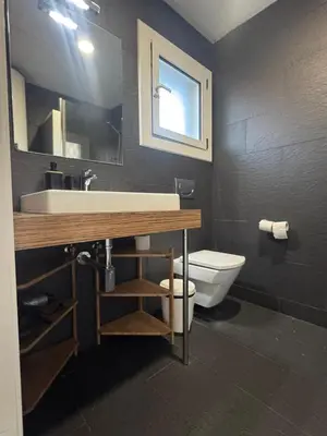 a bathroom with a sink and a toilet at Mery Castelldefels Beach in Castelldefels