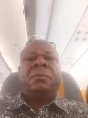 a man sitting in an airplane seat with ahat on his head at Timothee in Cornellà de Llobregat