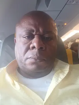 a man sitting in an airplane seat looking at the camera at Timothee in Cornellà de Llobregat