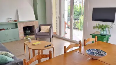 a living room with a couch and a table at Cozy apartment next to the beach in Sitges