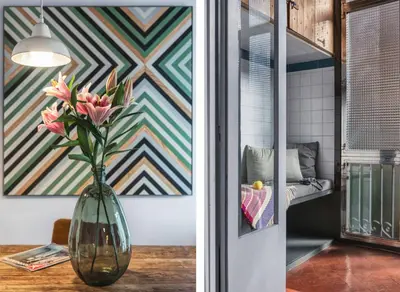 a vase filled with pink flowers sitting on a table at Brummell Apartments Eixample Derecha/Ballroom in Barcelona
