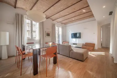 a dining room with a table and four chairs at Uptown Barcelona You Stylish Apartments in Barcelona