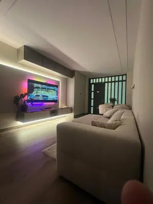 a bedroom with two beds and a flat screen tv at Beautiful duplex apartment in center Barcelona in Barcelona